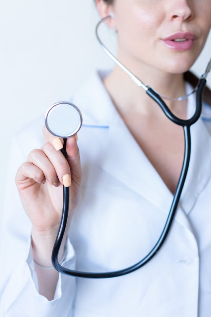 Doctor in a white shirt holding a stethoscope