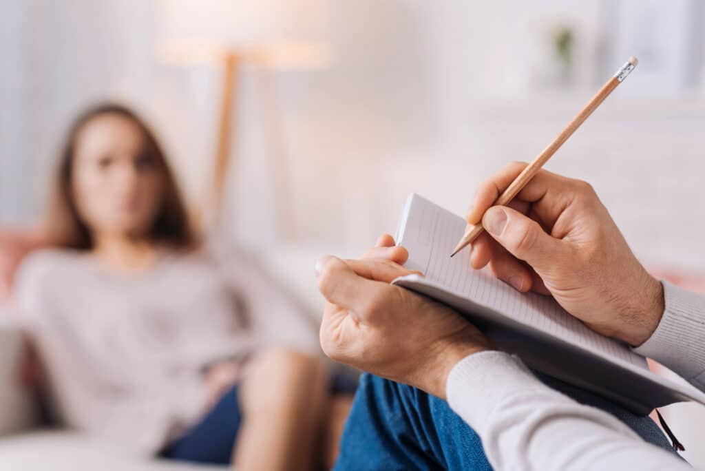 Pain management doctor speaking with a patient
