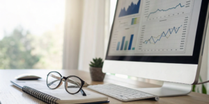 A desktop computer displaying performance charts for the best revenue cycle management companies.